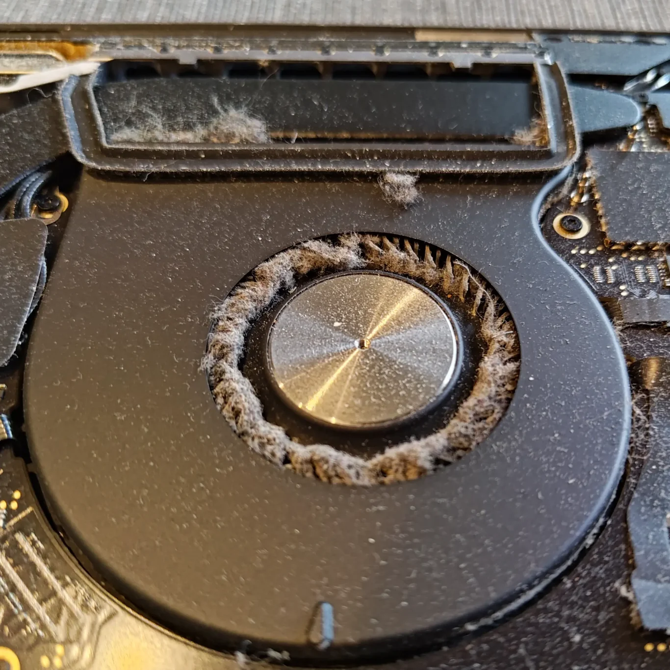 Felt Like Dust Buildup Blocking A Computer Heatsink And Preventing Proper Airflow Through The Fins