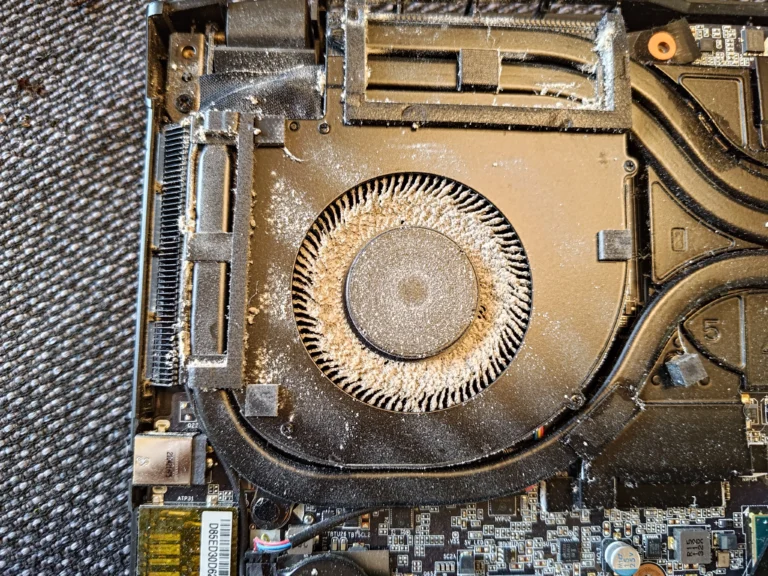 Dust on AORUS gaming laptop blower wheel and housing