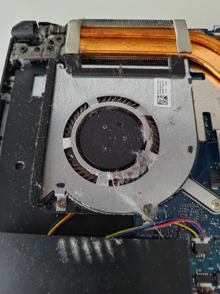 Dust on one ASUS FX506LH fan beside copper heat pipes