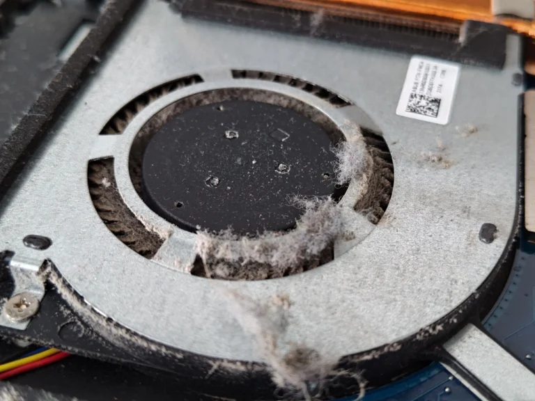 Close view of lint built up around ASUS FX506LH blower wheel