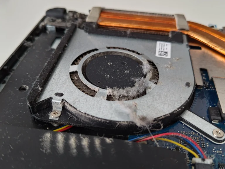 Pale fibre clump caught inside ASUS FX506LH-HN002T blower fan