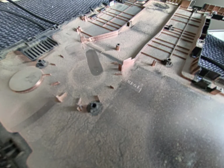 Dust film across underside of lifted ASUS R517S keyboard deck