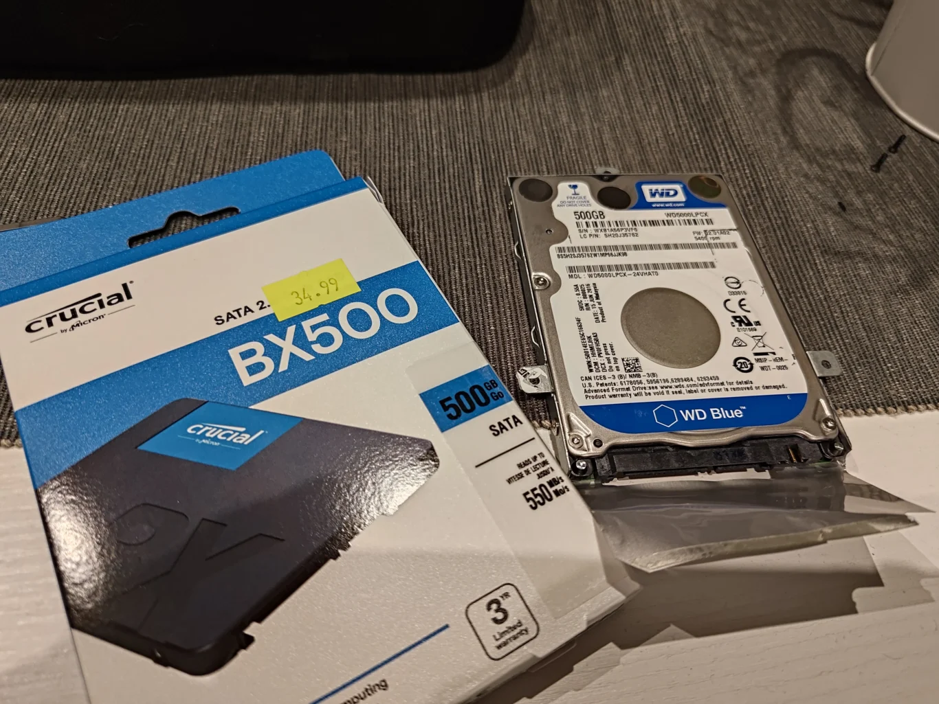 Crucial BX500 SSD package beside Western Digital 2.5-inch laptop hard drive