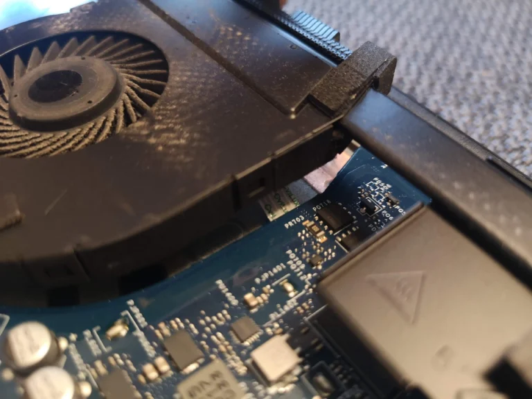 Dust on Dell Inspiron 15 5567 fan blades and shroud before removal