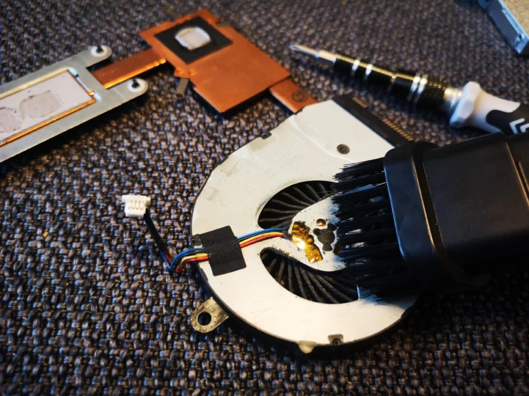 Brush cleaning inside the removed Inspiron 15 5567 blower
