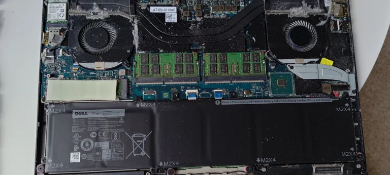 Opened Dell XPS with two blower fans and heat-pipe cooler