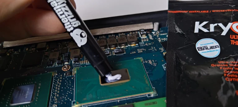 Thermal compound syringe at Dell XPS chip contact during cooler service