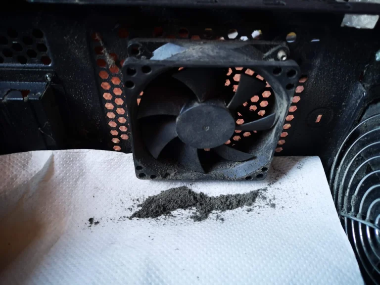 Desktop rear exhaust fan removed for access during deep cleaning