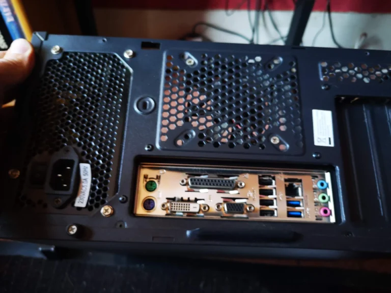 Rear of desktop tower with fan and power-supply ventilation areas visible
