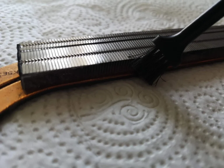 Brush cleaning the exposed Lenovo IdeaPad Gaming heatsink fin stack