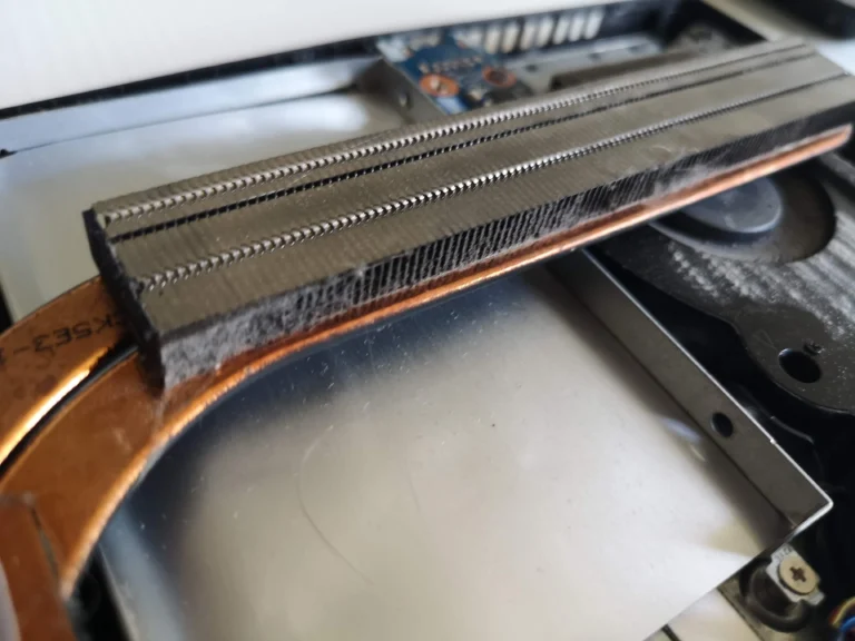 Close view through long metal cooling fins on Lenovo IdeaPad Gaming cooler