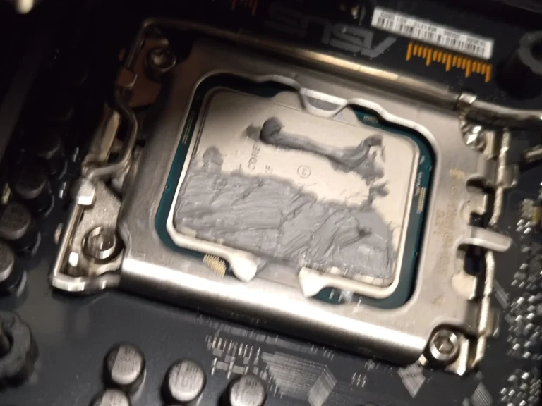 Old thermal compound on Intel processor after AIO cooler block removal