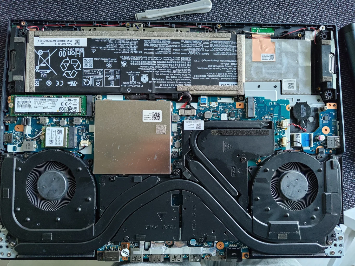 Opened Lenovo Legion 5 15ACH6H showing two fans and shared heatsink