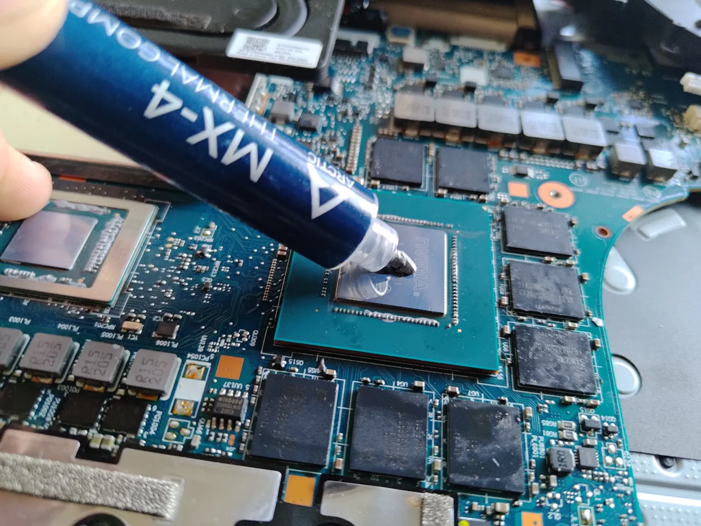 Fresh thermal compound dispensed onto Lenovo Legion 5 15ACH6H graphics chip