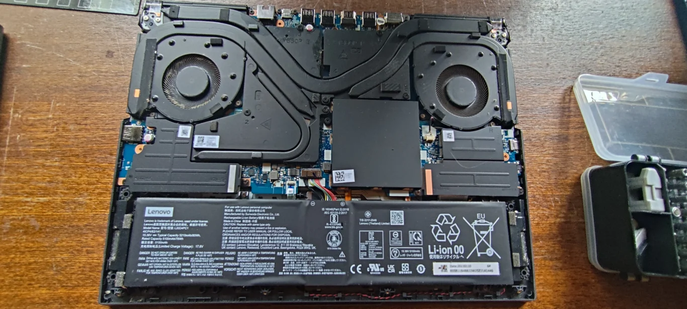 Lenovo Legion 5 Pro 16ITH6H open to show two fans, heat pipes and battery