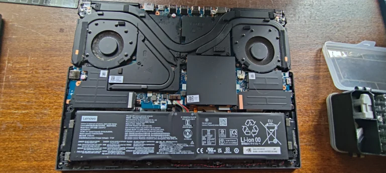 Lenovo Legion 5 Pro 16ITH6H open to show two fans, heat pipes and battery