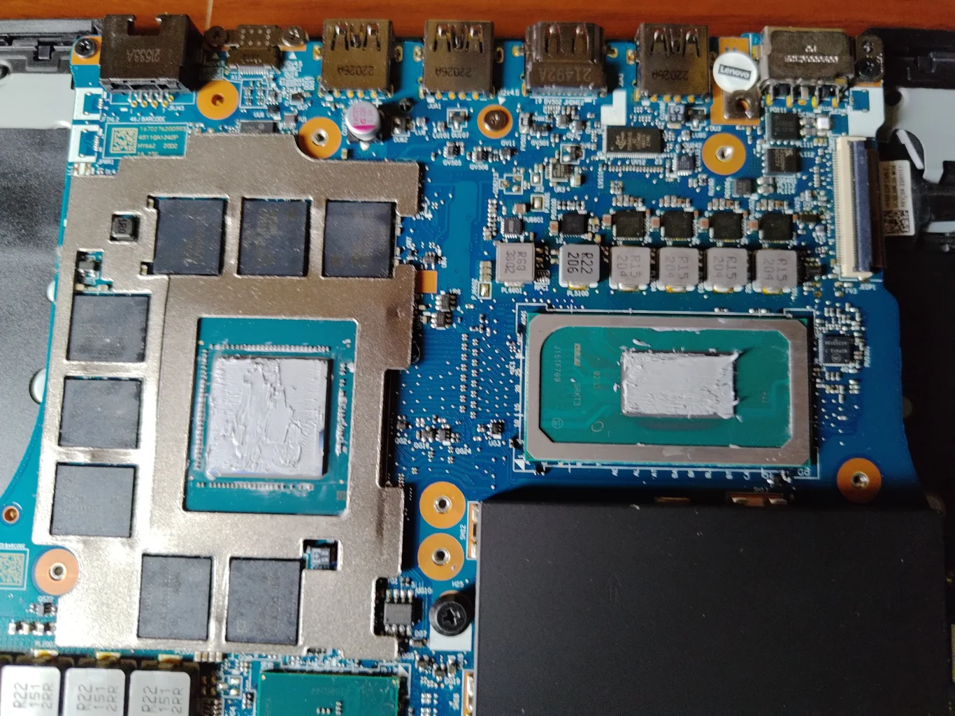 Two Legion 5 Pro chip surfaces with old thermal compound after cooler removal
