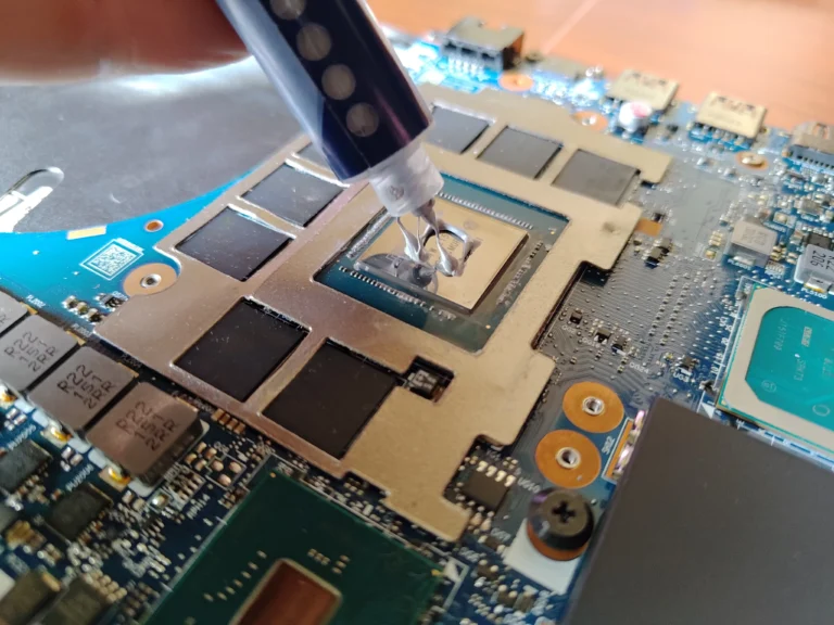 Fresh thermal compound dispensed onto Lenovo Legion graphics chip