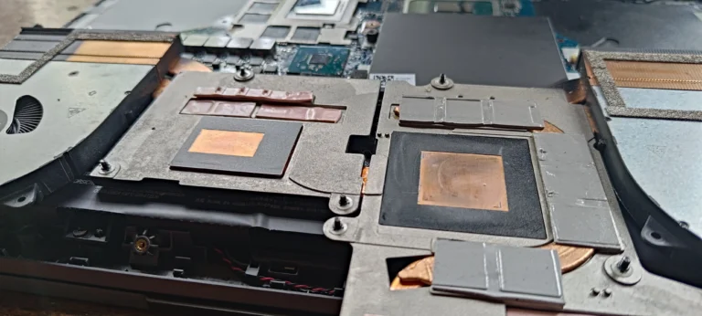 Underside of Lenovo Legion heatsink showing two contact plates and surrounding thermal pads