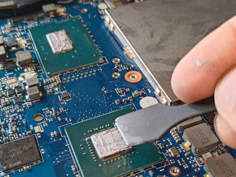 Old thermal compound being cleaned from a Legion Y530 chip surface