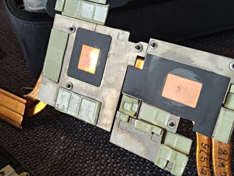 Legion Y530 shared cooler underside showing two copper plates and surrounding thermal pads