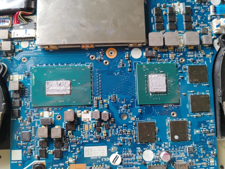 Fresh thermal material visible on cleaned processor and graphics chip in Legion Y530