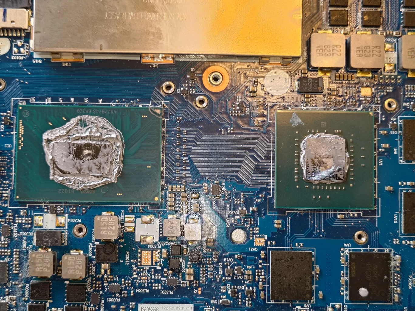 Old thermal compound on two exposed chips in Lenovo Legion Y530