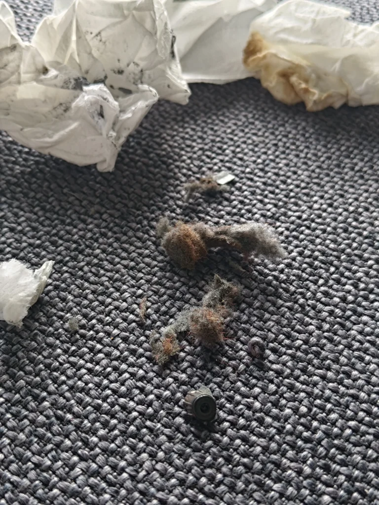 Clumps of fibrous dust collected during Lenovo Legion Y530 cleaning