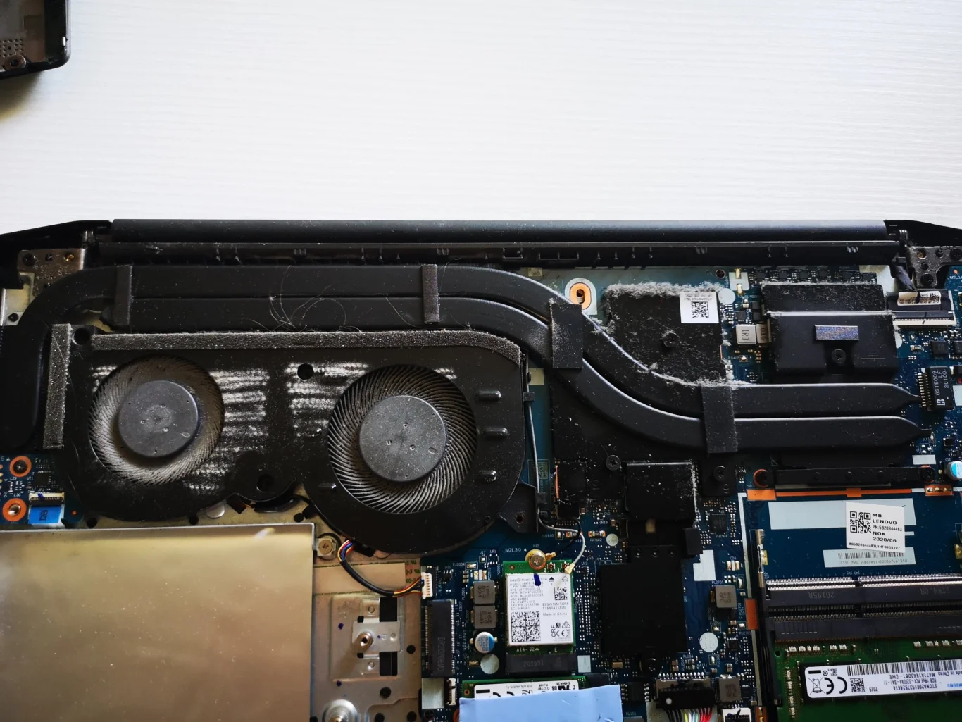 Open Lenovo IdeaPad Gaming laptop with two blower wheels in one long fan housing