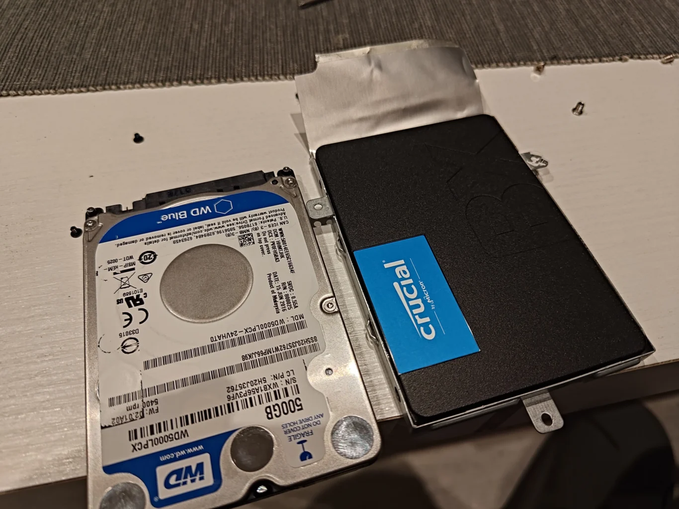 Crucial solid-state drive alongside original Western Digital laptop hard drive