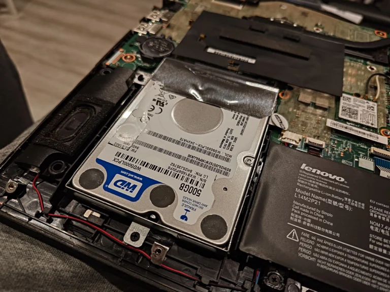 Original Western Digital hard drive seated in Lenovo laptop carrier