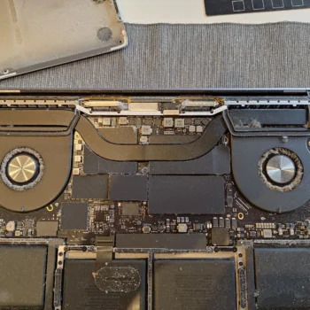 MacBook Pro 16-inch A2141 opened to show both cooling fans before cleaning