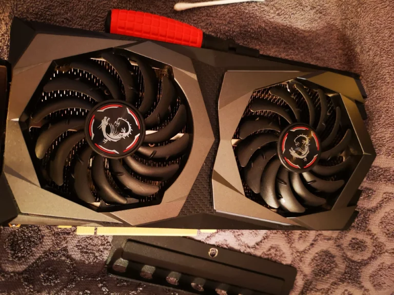 MSI dual-fan graphics card removed from a gaming desktop for cleaning