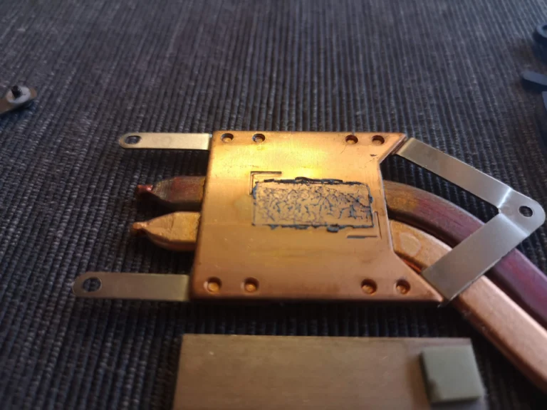 Lifted MSI GF63 copper cooler showing old thermal interface material