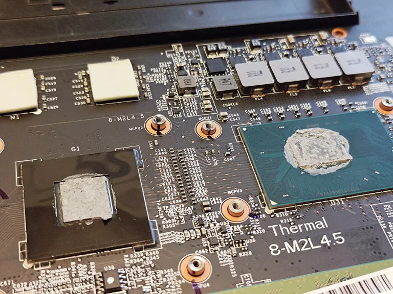 Old thermal paste exposed on two chips inside MSI GP72M 7REX