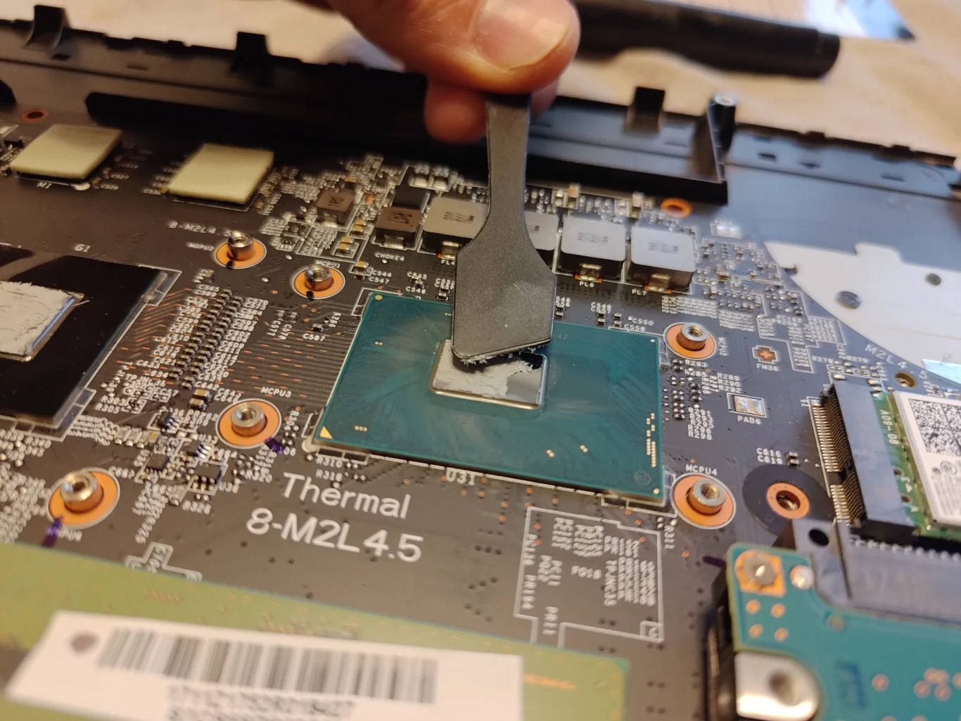 Old thermal compound being removed from the MSI GP72M 7REX chip surface