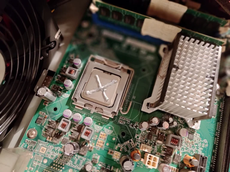 Fresh thermal compound placed on Intel desktop processor before cooler refitting