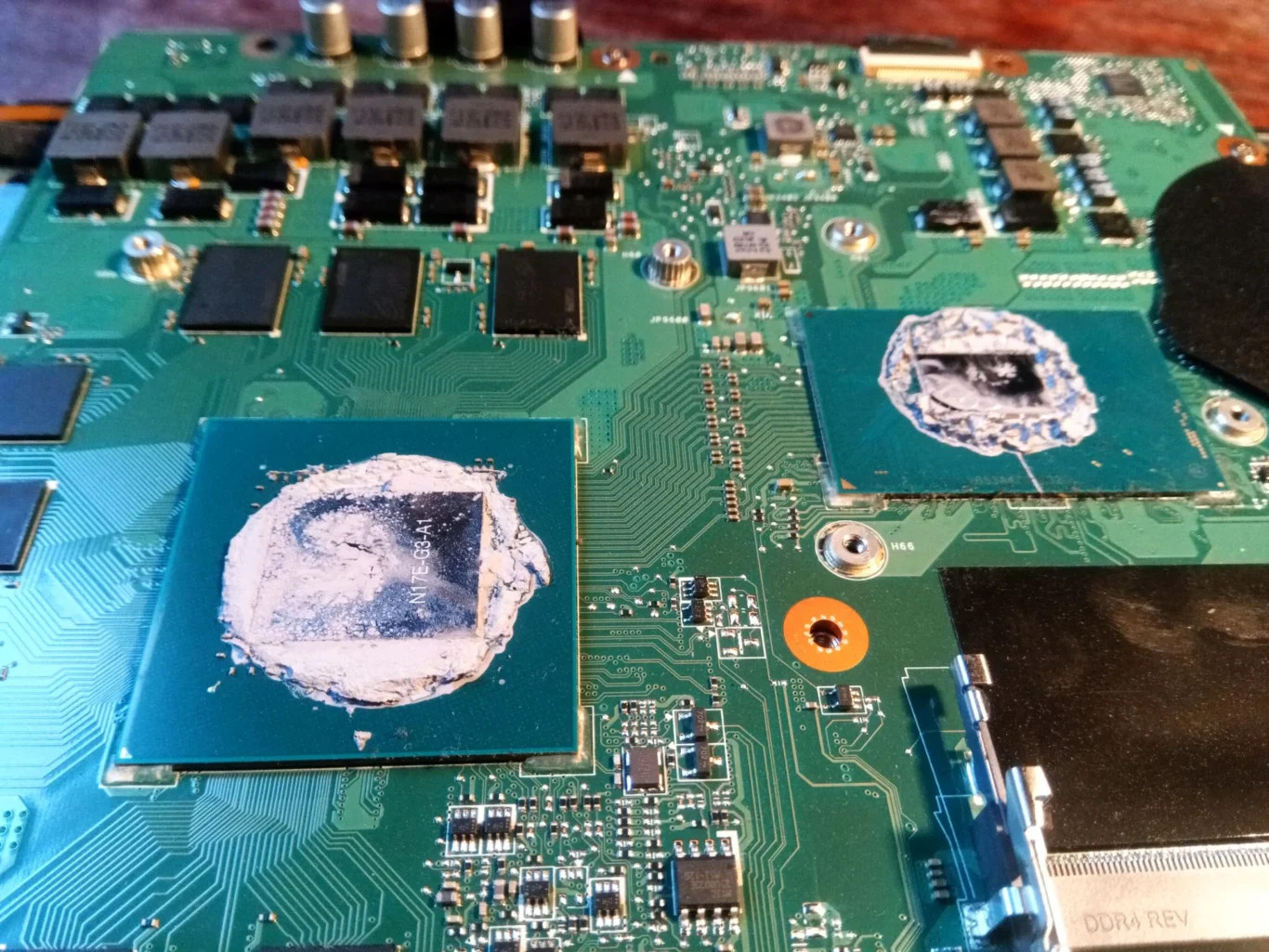 Old compound on two exposed chip contacts inside Acer Predator 17 X