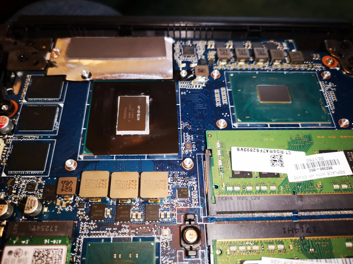 Razer gaming laptop chips and board exposed after cooling assembly removal
