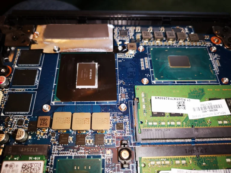 Razer gaming laptop chips and board exposed after cooling assembly removal