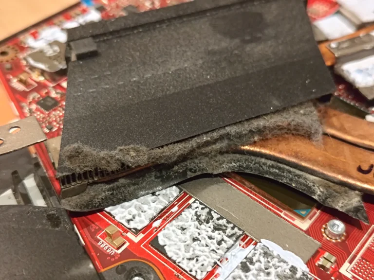 Thick felt-like lint packed against the ROG Zephyrus GU502G heatsink outlet