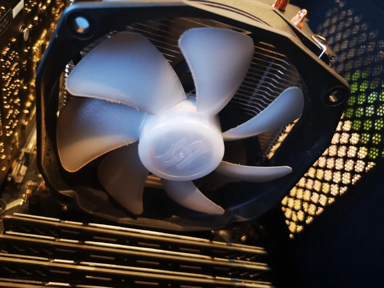 Desktop rear case fan blades and grille during cooling inspection