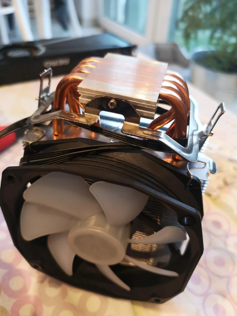 Ryzen tower CPU cooler with exposed copper base after cleaning