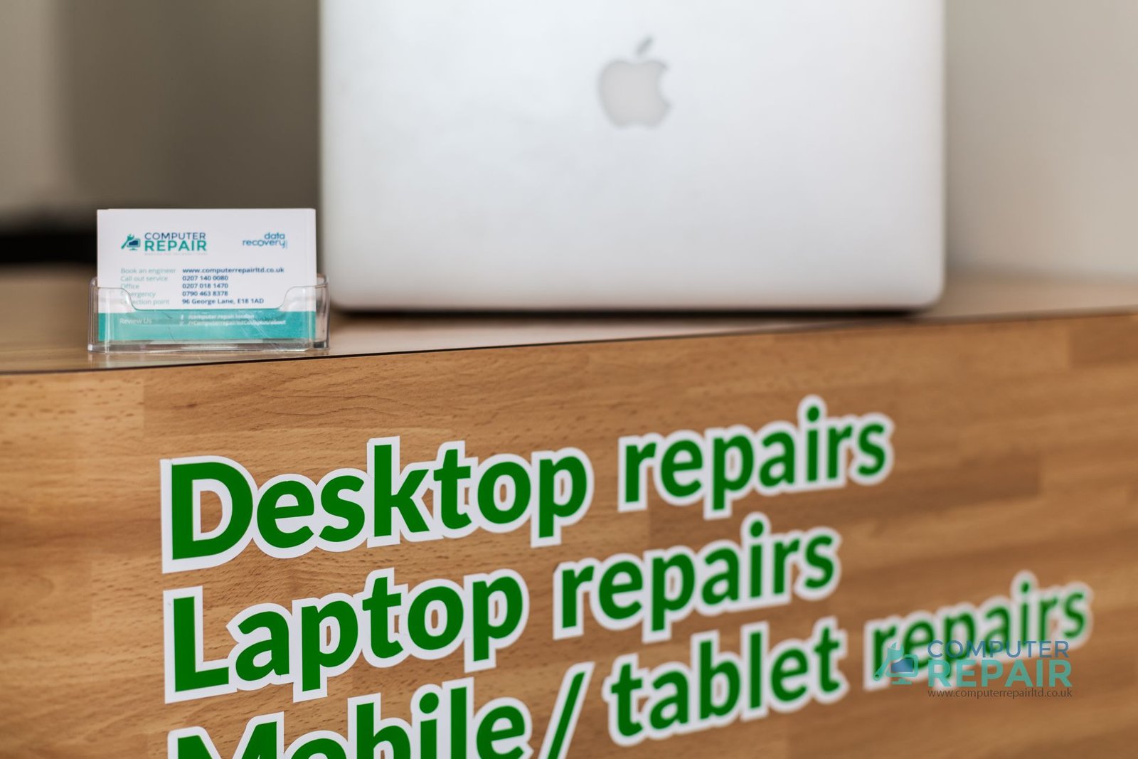 Computer Repair Ltd workshop counter with a laptop